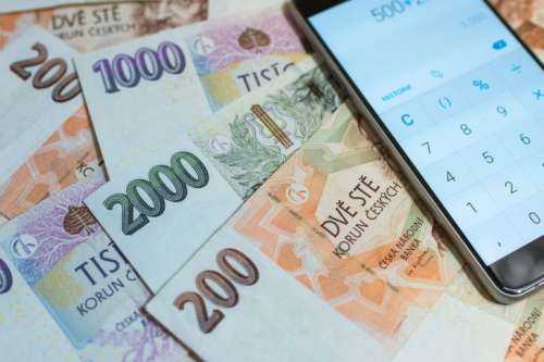 Czech money. Czech crown. Calculating Finance on a Calculator of Smartphone