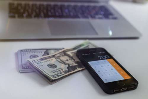 Counting Dollars on calculator on smartphone