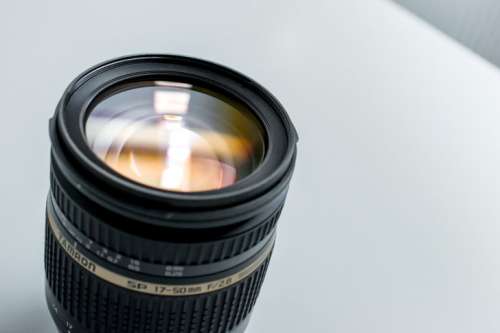 Modern lens on a photographer’s desk