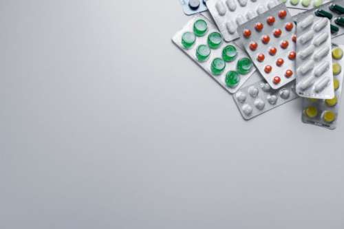 Medicine pills in packs. Full screen background
