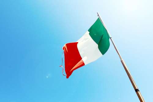 Beautiful azure sky with flag of Italy