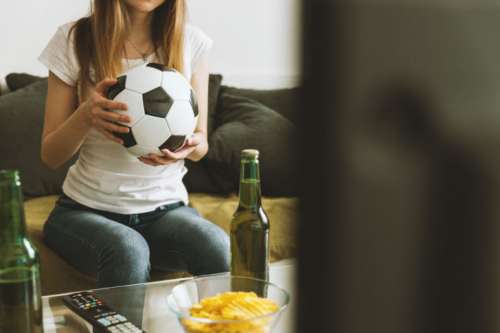 Girl watching soccer match