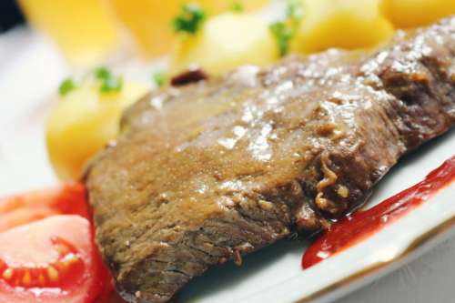 Detail beef with potatoes on a plate