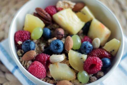 Nice detail of musli with fruit and nuts in a bowl