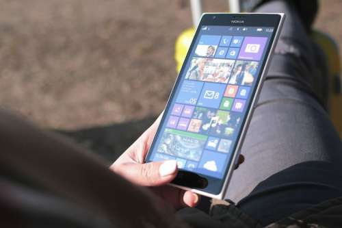 Big smartphone in girls hand in traveling