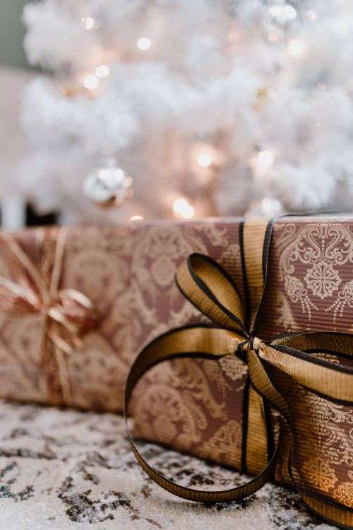 Elegantly wrapped gifts with golden ribbon
