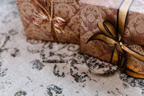 Elegantly wrapped gifts with golden ribbon