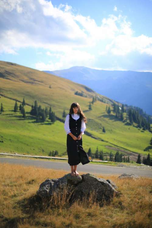 Girl standing in front of Mountain
