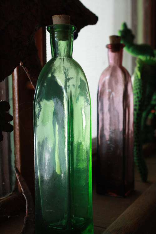 Glass Bottle in Window Sill