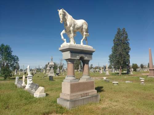 Horse Sculpture atop Gravestone in old Cemetery