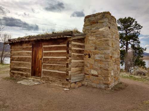 Log Cabin with Stone Chimney