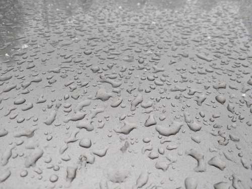Raindrops on Silver Metal Surface