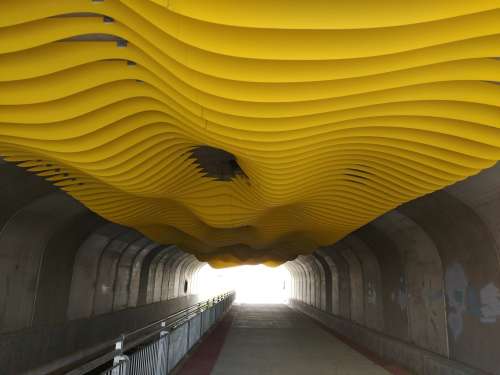 Tunnel with Yellow Wavy Ceiling Art Installation