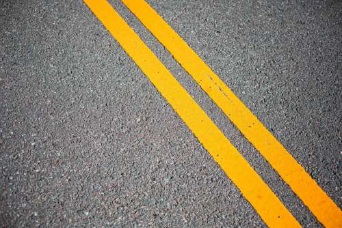Asphalt Road with Yellow Road Lines