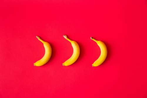 Bananas with Red Flat Background