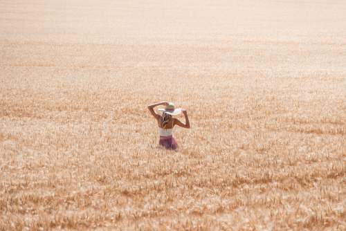Beautiful Woman in Wheat Field