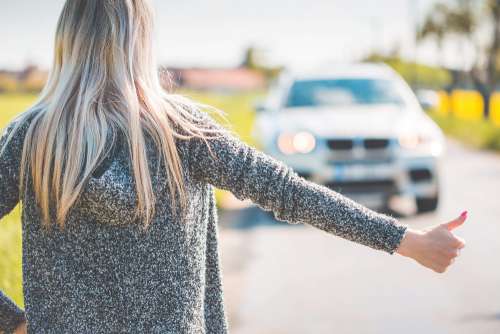 Blonde Woman Hitchhiking Because of Her Broken Car