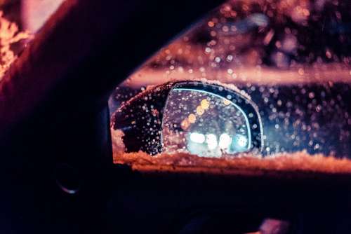 Car Rear-View Side Mirror in Snowy Weather