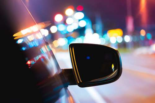 Car Side Rear-View Mirror with City Bokeh Lights