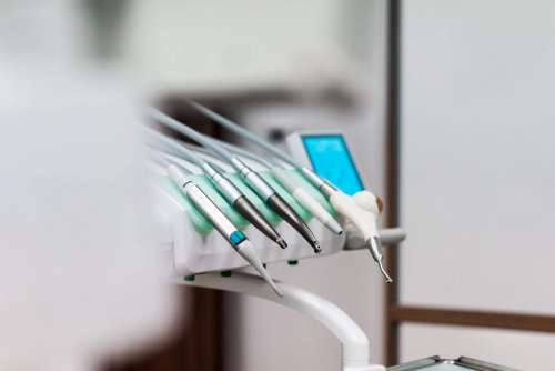 Dental Tool Station with Drills and Instruments in Dentist Office
