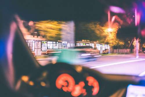 Driver Racing Against City Tram at Night