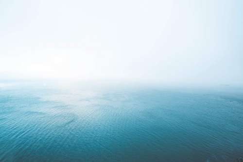 Blue Endless Ocean in Fog