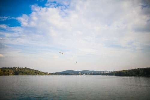 Four Hot Air Balloons over Lake