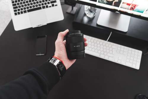 Holding Sony Zeiss Sonnar FE 55mm f/1.8 Lens in Hand #2