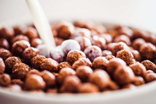 Milk Pouring on Cereal Chocolate Balls