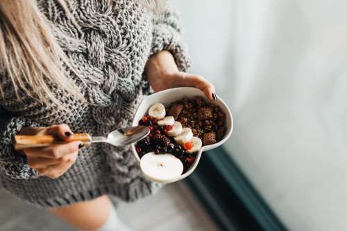 Woman in Knitted Sweater Enjoying Morning Breakfast