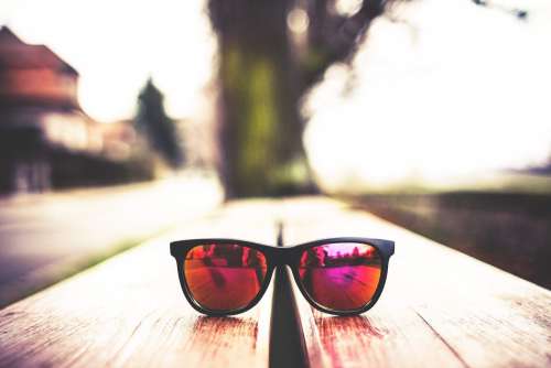 Red Fashion Glasses on Wooden Table