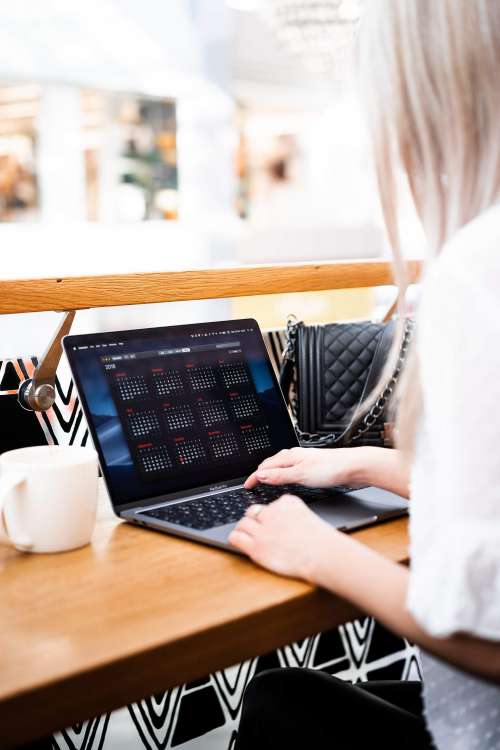 Young Woman Remote Working in a Café