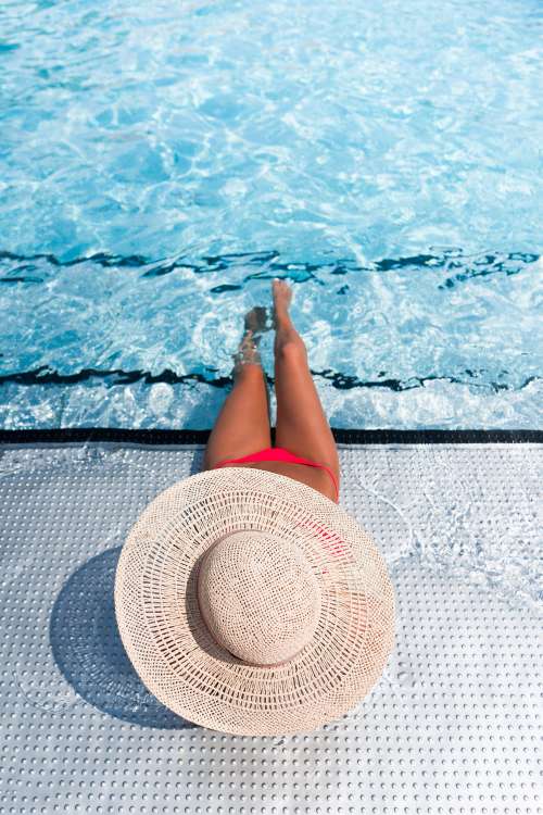 Young Sexy Woman in Swimming Pool