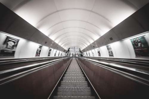 Symmetric Public Transport Network Underground Escalator