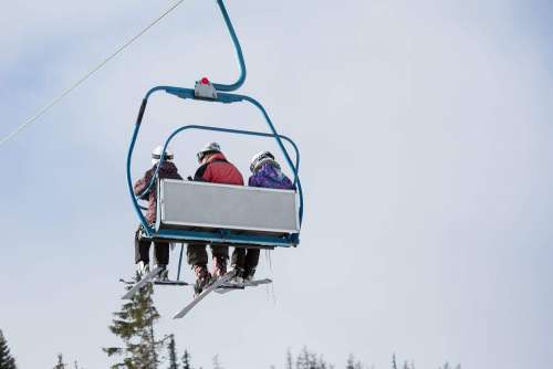 Three Skiers on Ski Lift