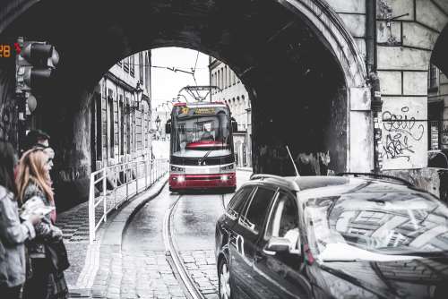 Tram Going Through The Tunnel Under The Bridge