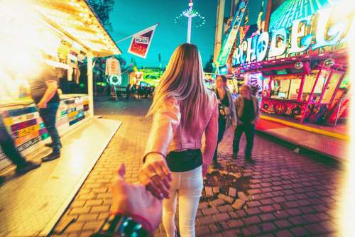 Walking Through Amusement Park with a Girl