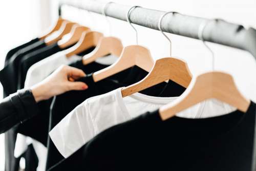 Woman Choosing T-Shirts During Clothing Shopping at Apparel Store #2