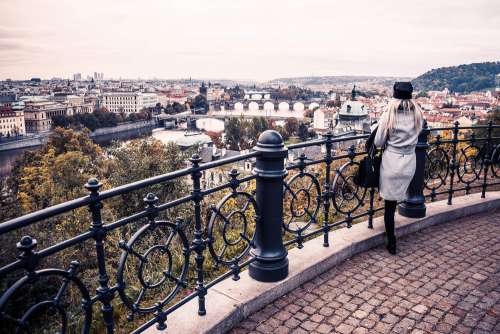 Woman Looking Over The Autumn Prague