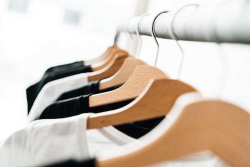Wooden T-Shirt Hangers in Fashion Apparel Store