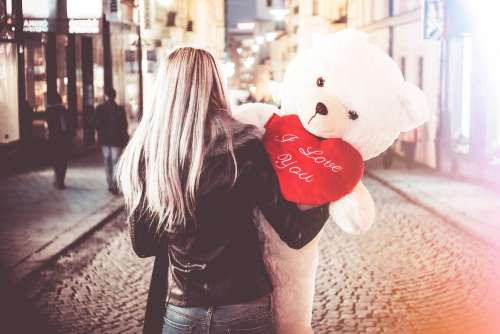 Young Woman Holding Her Big Valentine’s Day Gift Teddy Bear