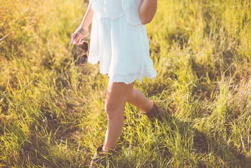 Young Girl Enjoying Her Free Time In a Sunny Meadow