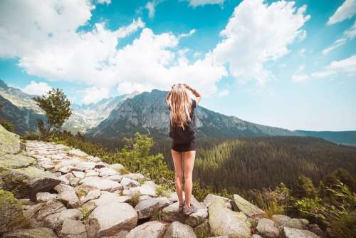 Young Woman Traveler Enjoying a View on High Tatras Mountains