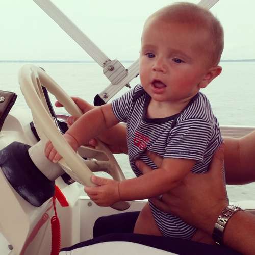 Baby Boy Driving Boat Ocean Gulf Of Mexico