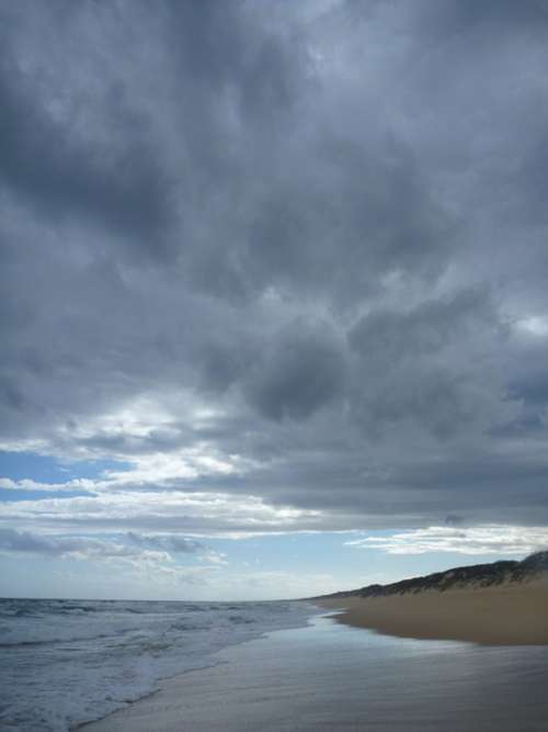 Beach Clouds Low Water Wave On Beach Australia