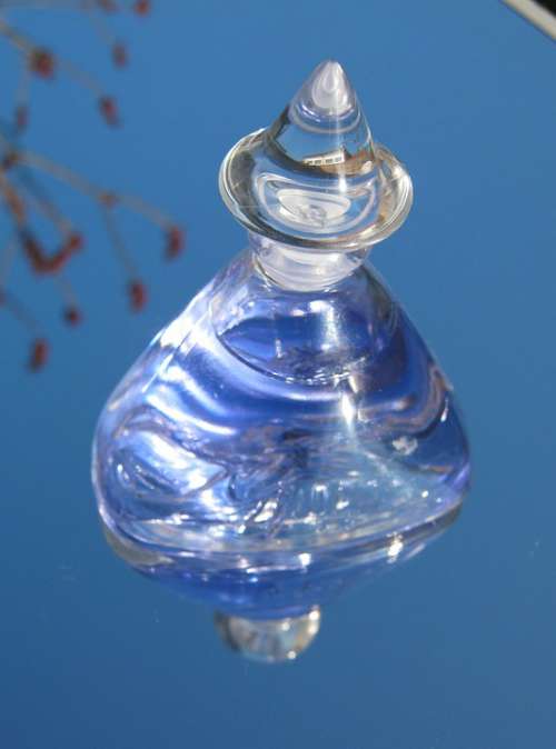 Bottle Blue Perfume Reflecting