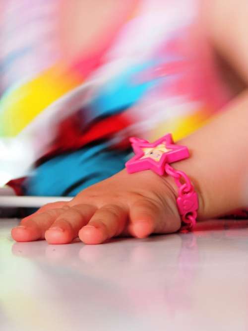 Child'S Hand A Children'S Toy Bracelet