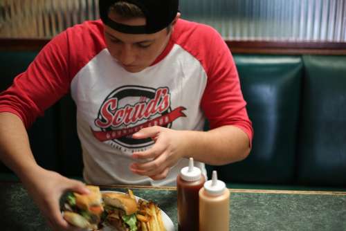 Fast Food Man Eating Burger Inside Food Male