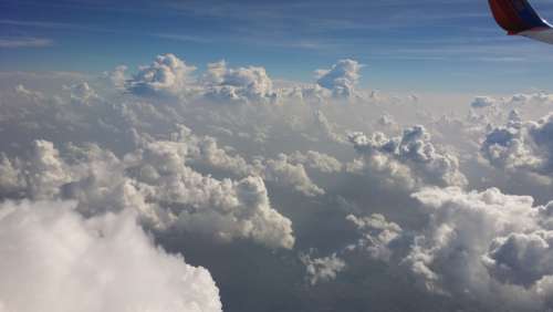 Fluffy White Clouds Airplane View Sky