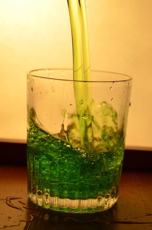 Liquid Green Glass Splash Pouring Alcohol Drink